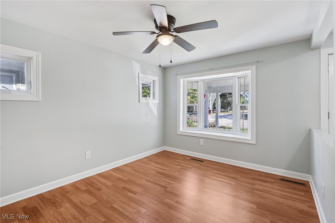 159 Eastland Road Berea, OH 44017 - Photo 15 of 38 Spare room with wood finished floors and ceiling fan