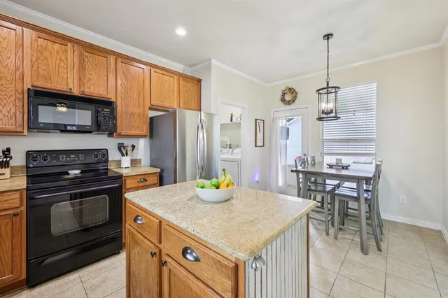a kitchen with a stove a sink and a refrigerator