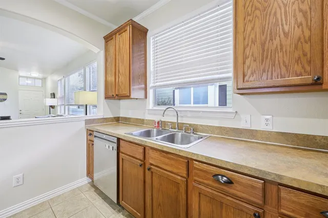 a kitchen with a sink and cabinets
