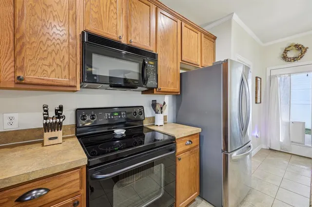 a kitchen with a stove and a microwave