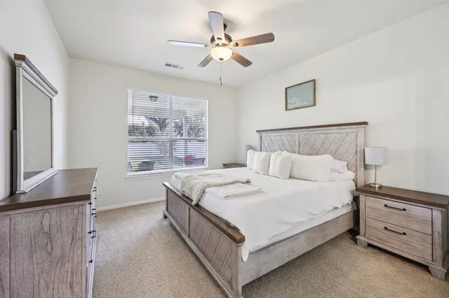 a bed room with a bed and a window