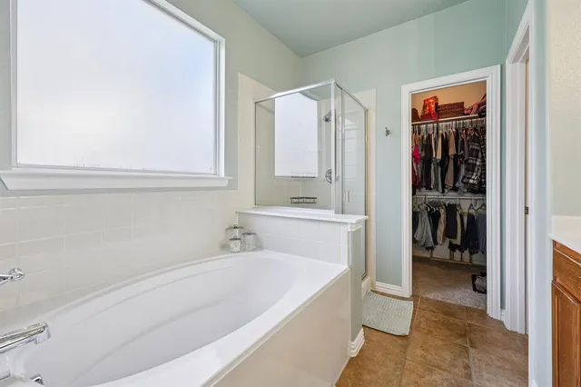 a bathroom with a bathtub and a sink