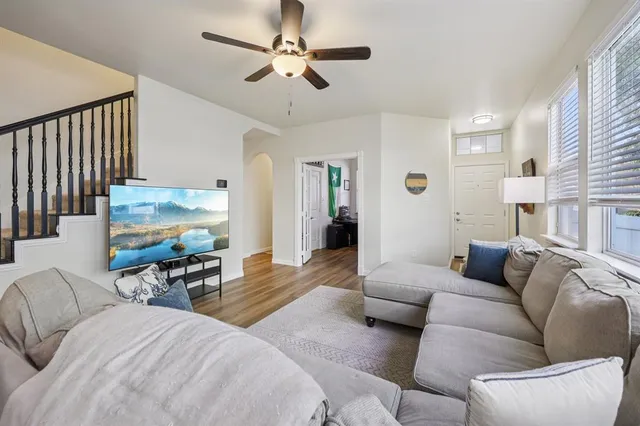 a living room with furniture and a flat screen tv