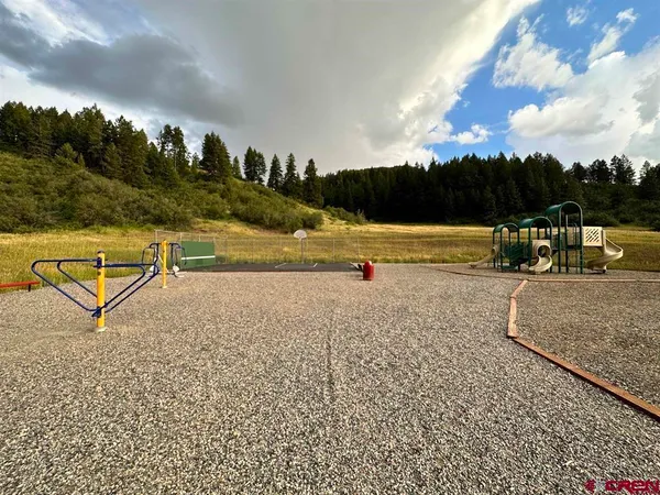 a view of a lake with a yard