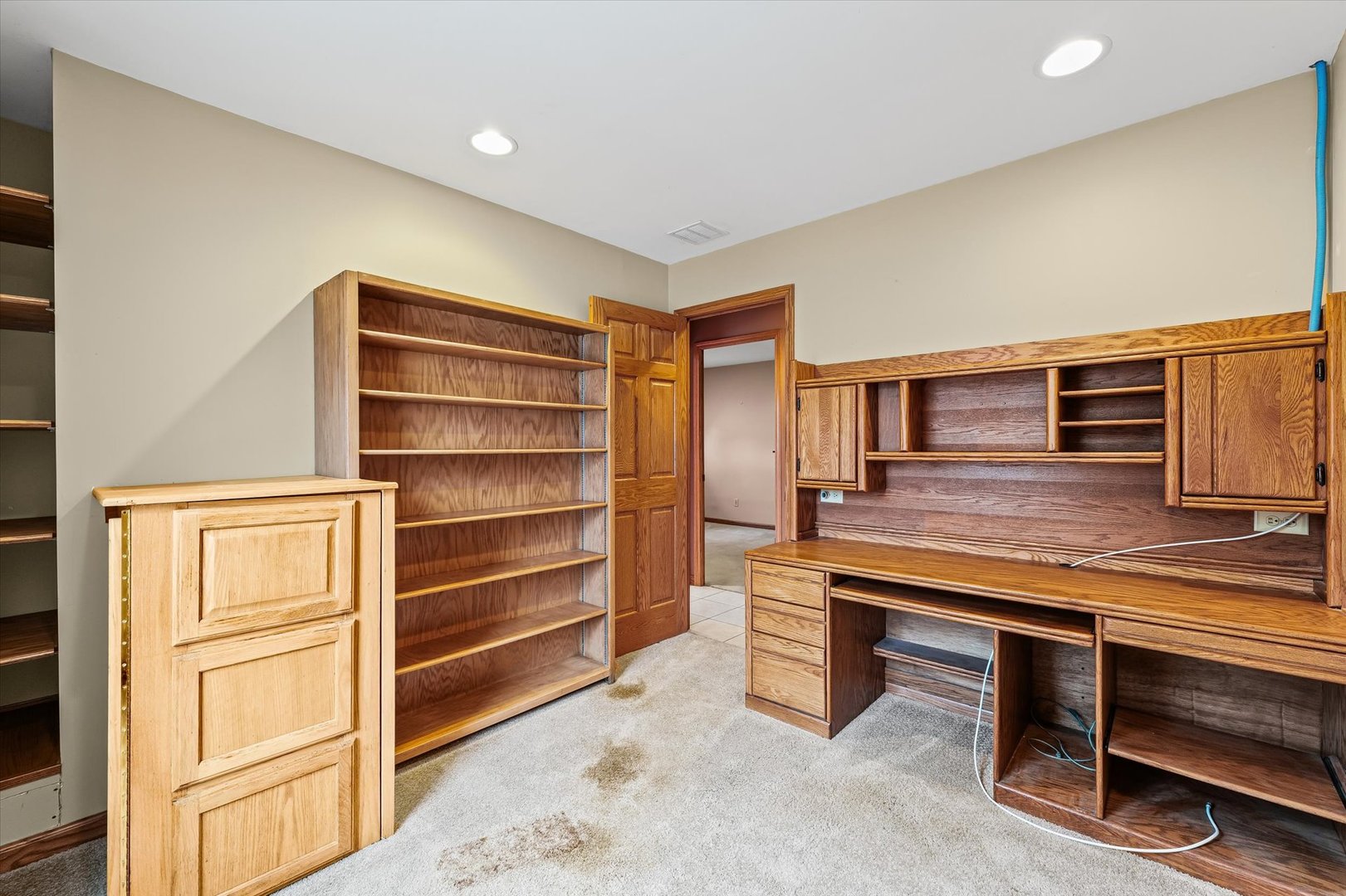 2801 West William Street Champaign, IL 61821 - Photo 18 of 30 a hallway view with wooden floor and furniture