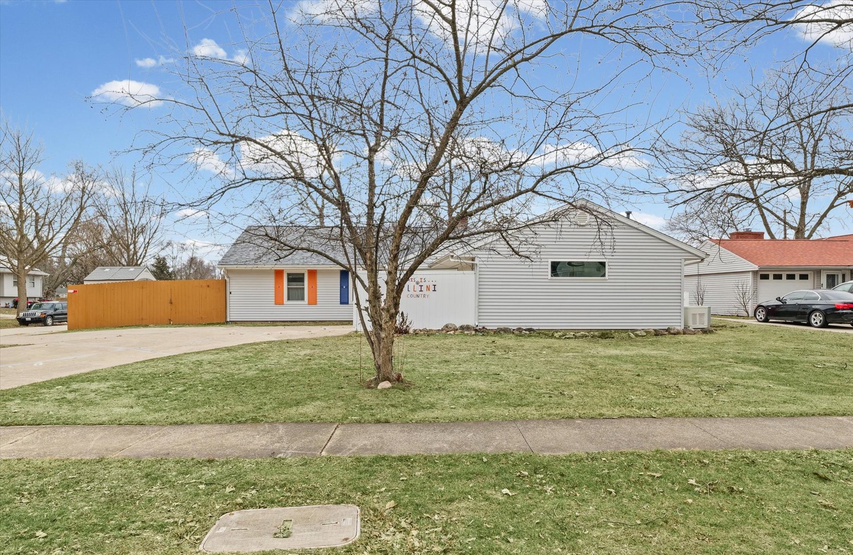 2801 West William Street Champaign, IL 61821 - Photo 2 of 30 a backyard of house with a garden and trees