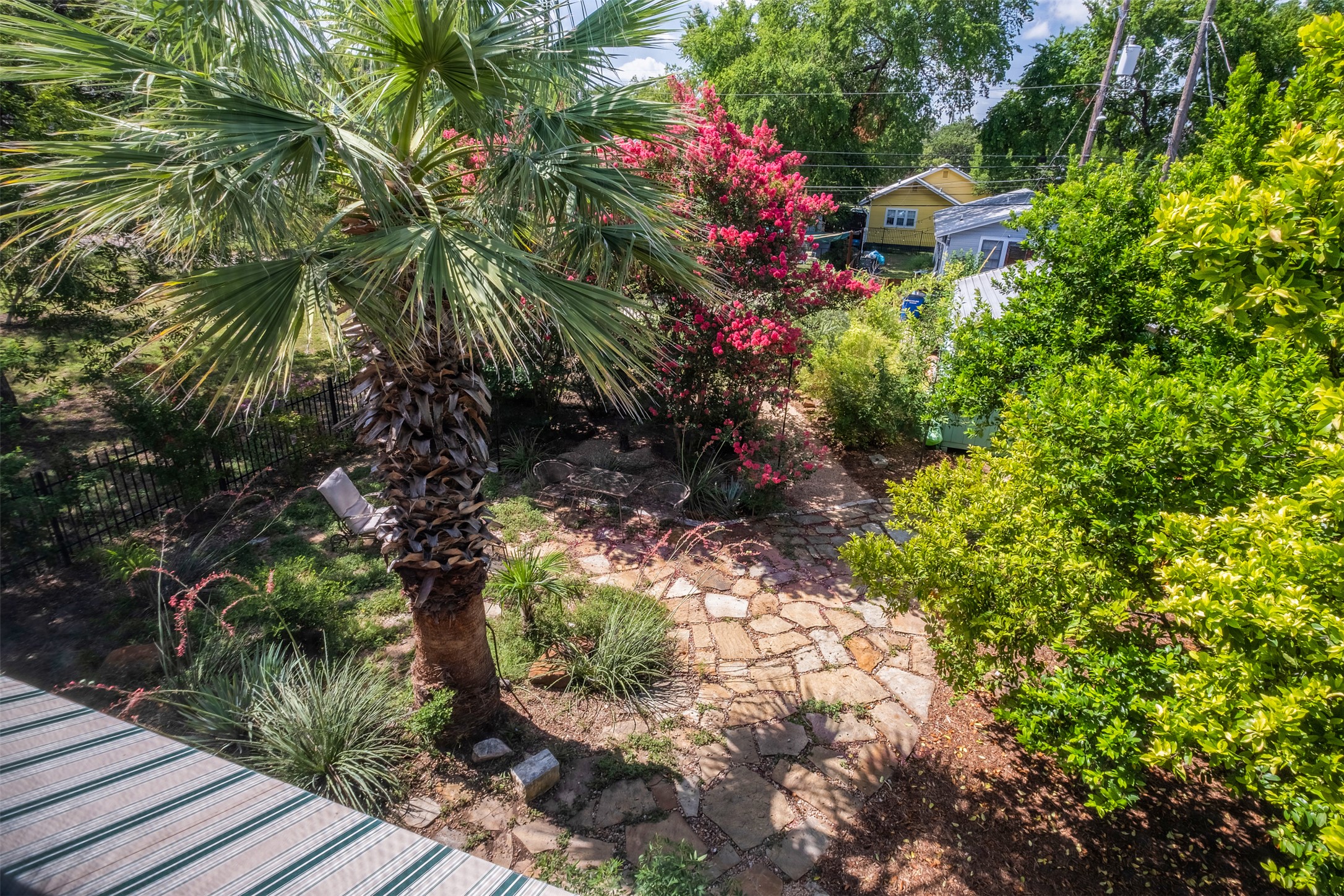 903 East 14th Street Austin, TX 78702 - Photo 18 of 31 View of the lush backyard from the upstairs screened porch