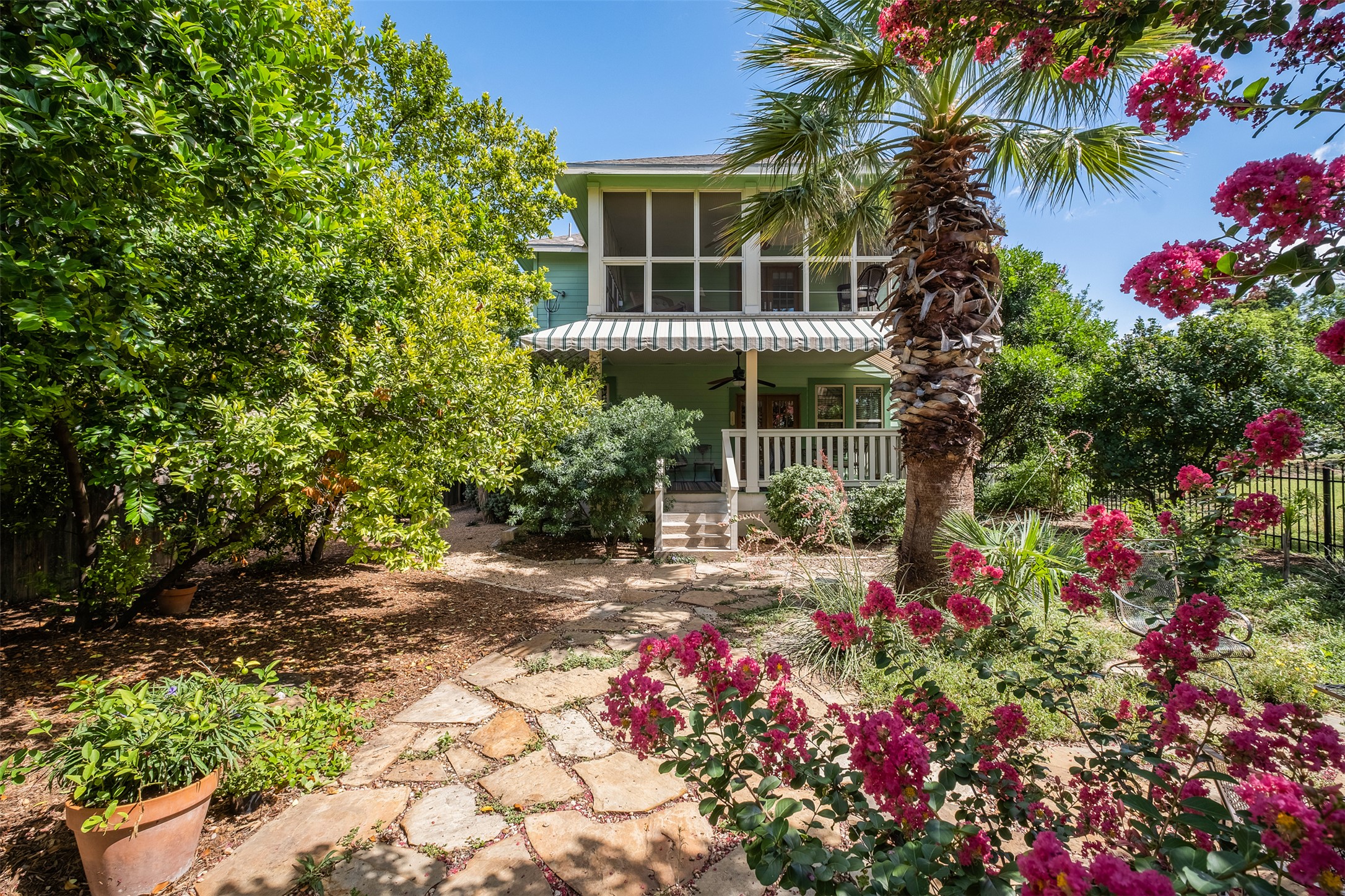 903 East 14th Street Austin, TX 78702 - Photo 2 of 31 View of the back porches from the lush backyard