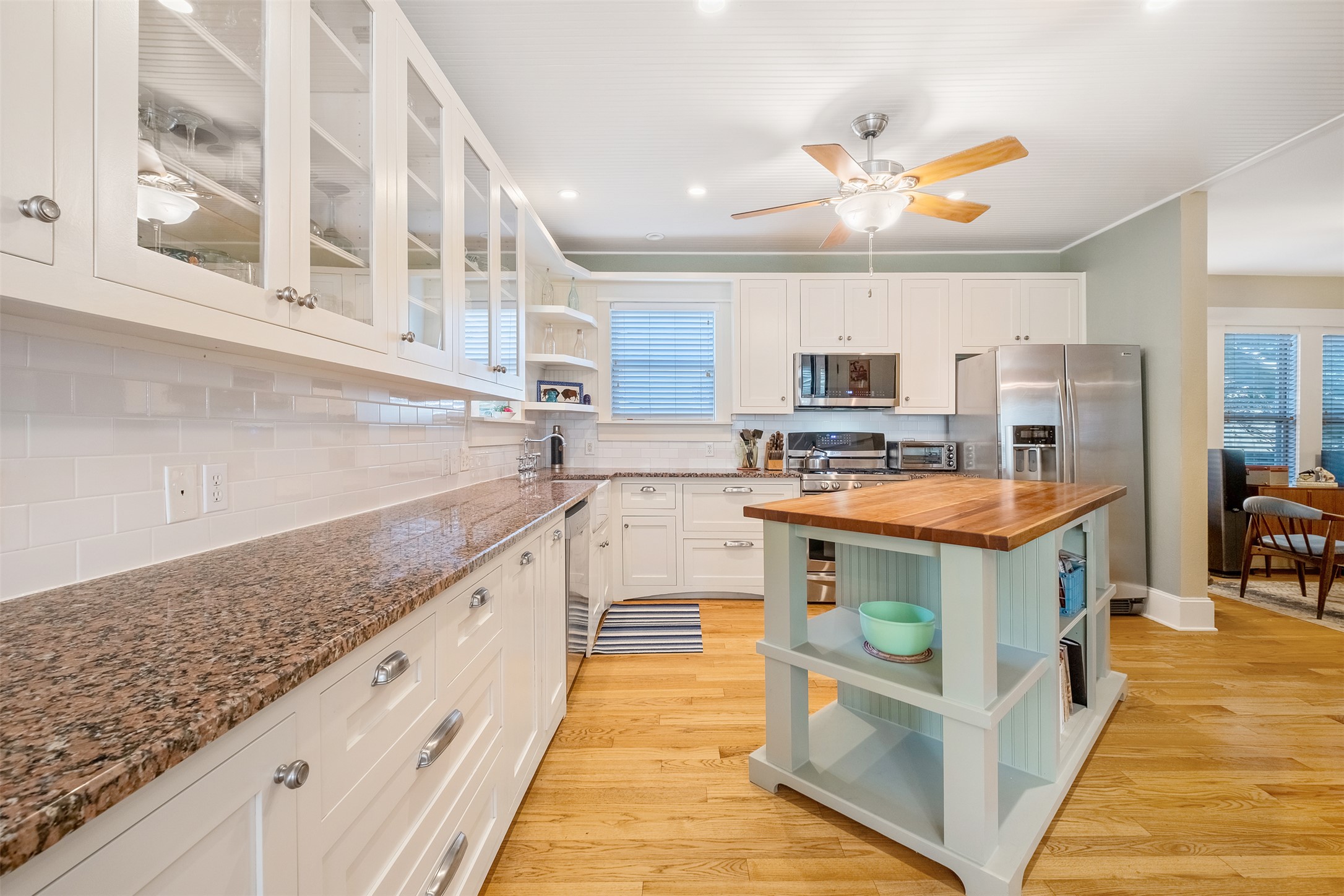 903 East 14th Street Austin, TX 78702 - Photo 9 of 31 Airy kitchen with butcher block island and other custom cabinetry