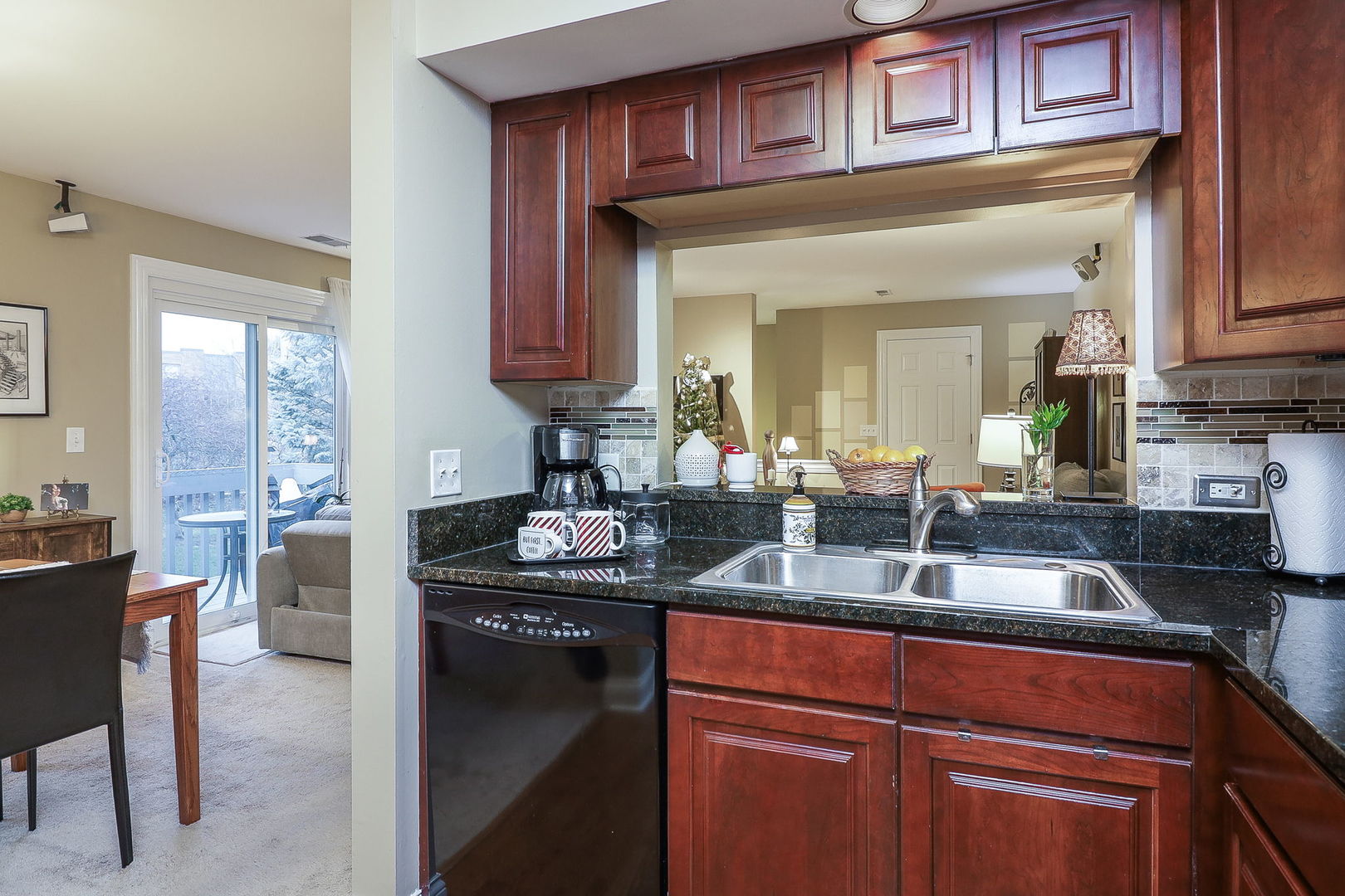 43 Foxcroft Road, Unit 203 Naperville, IL 60565 - Photo 11 of 19 a kitchen with stainless steel appliances granite countertop a sink stove and cabinets