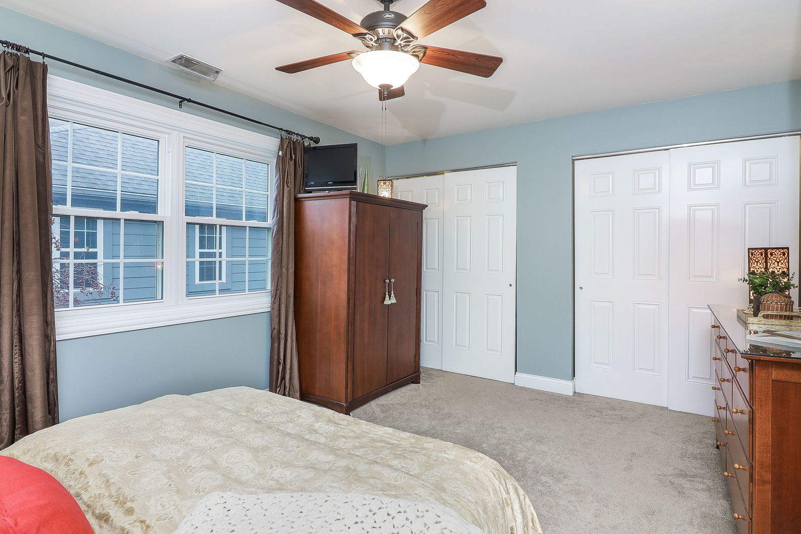 43 Foxcroft Road, Unit 203 Naperville, IL 60565 - Photo 13 of 19 a bedroom with a bed and a chandelier