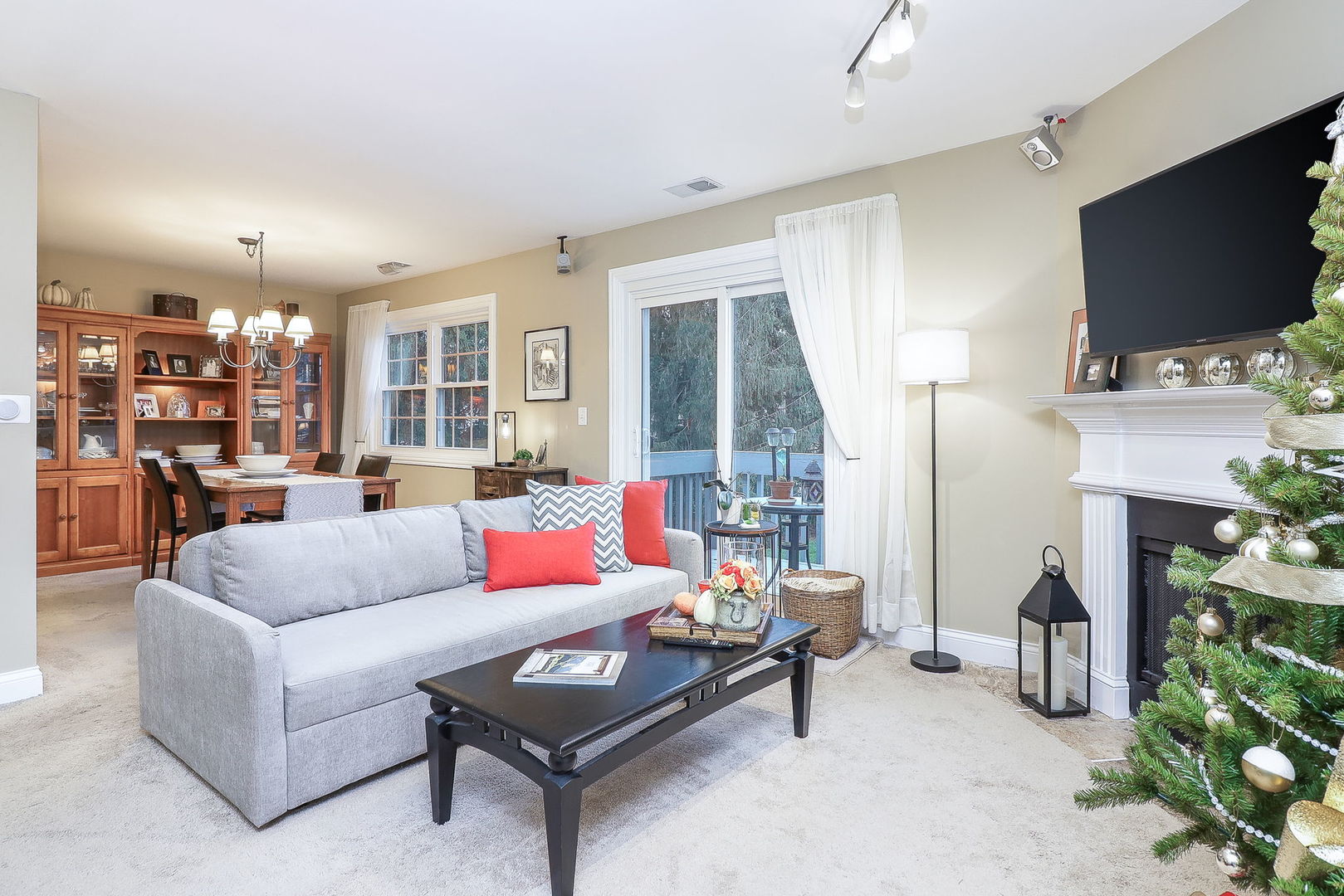 43 Foxcroft Road, Unit 203 Naperville, IL 60565 - Photo 4 of 19 a living room with fireplace furniture and a flat screen tv