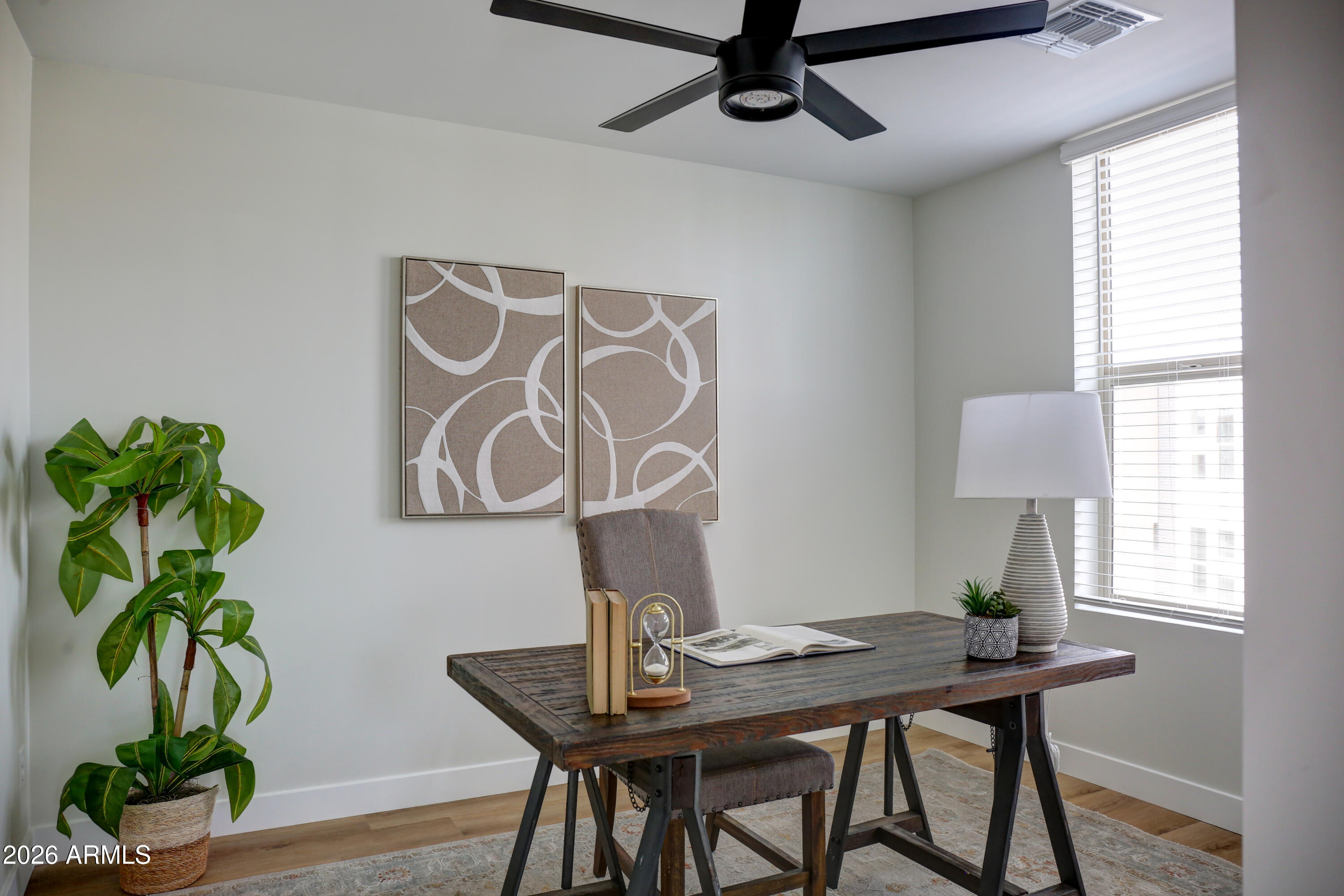 630 North Power Road, Unit 102 Mesa, AZ 85205 - Photo 7 of 13 a view of a workspace with furniture and a window