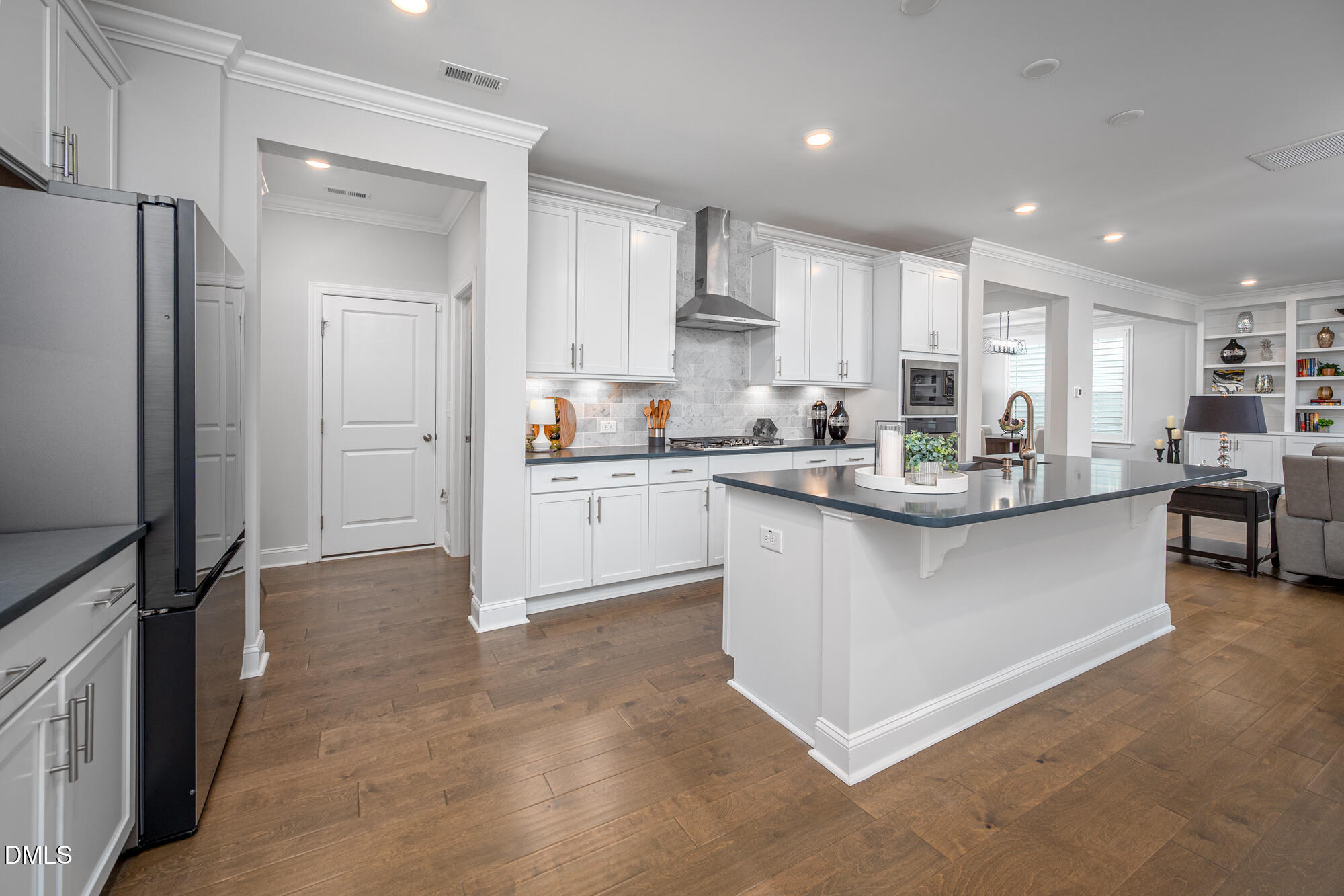319 High Woods Ridge Chapel Hill, NC 27517 - Photo 17 of 71 a kitchen with stainless steel appliances granite countertop a refrigerator sink and white cabinets