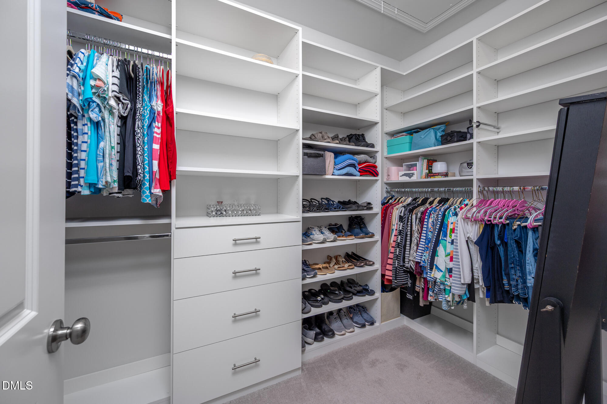 319 High Woods Ridge Chapel Hill, NC 27517 - Photo 29 of 71 a view of walk in closet with clothes and shoes