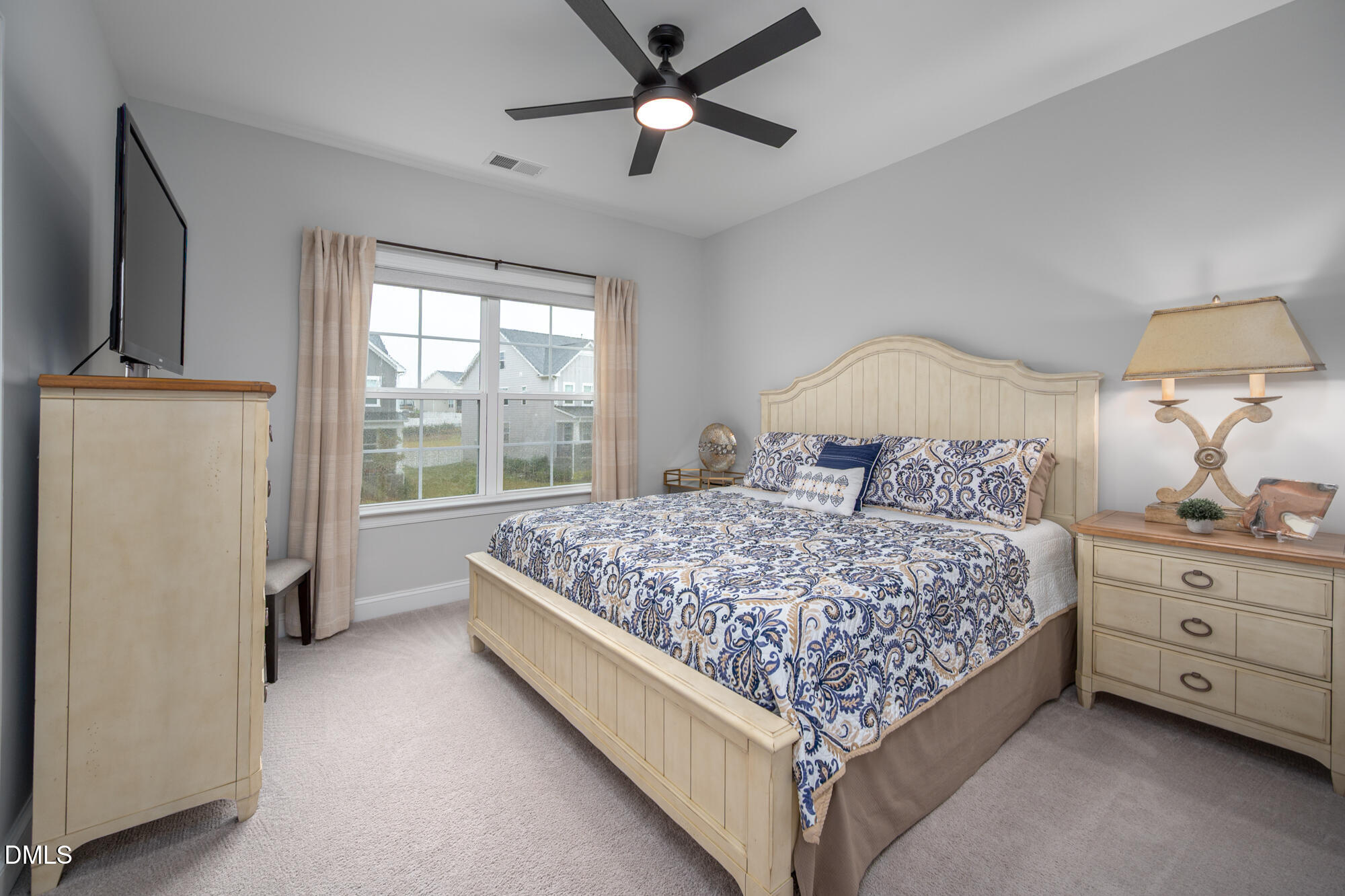 319 High Woods Ridge Chapel Hill, NC 27517 - Photo 30 of 71 a bedroom with a bed and a chandelier