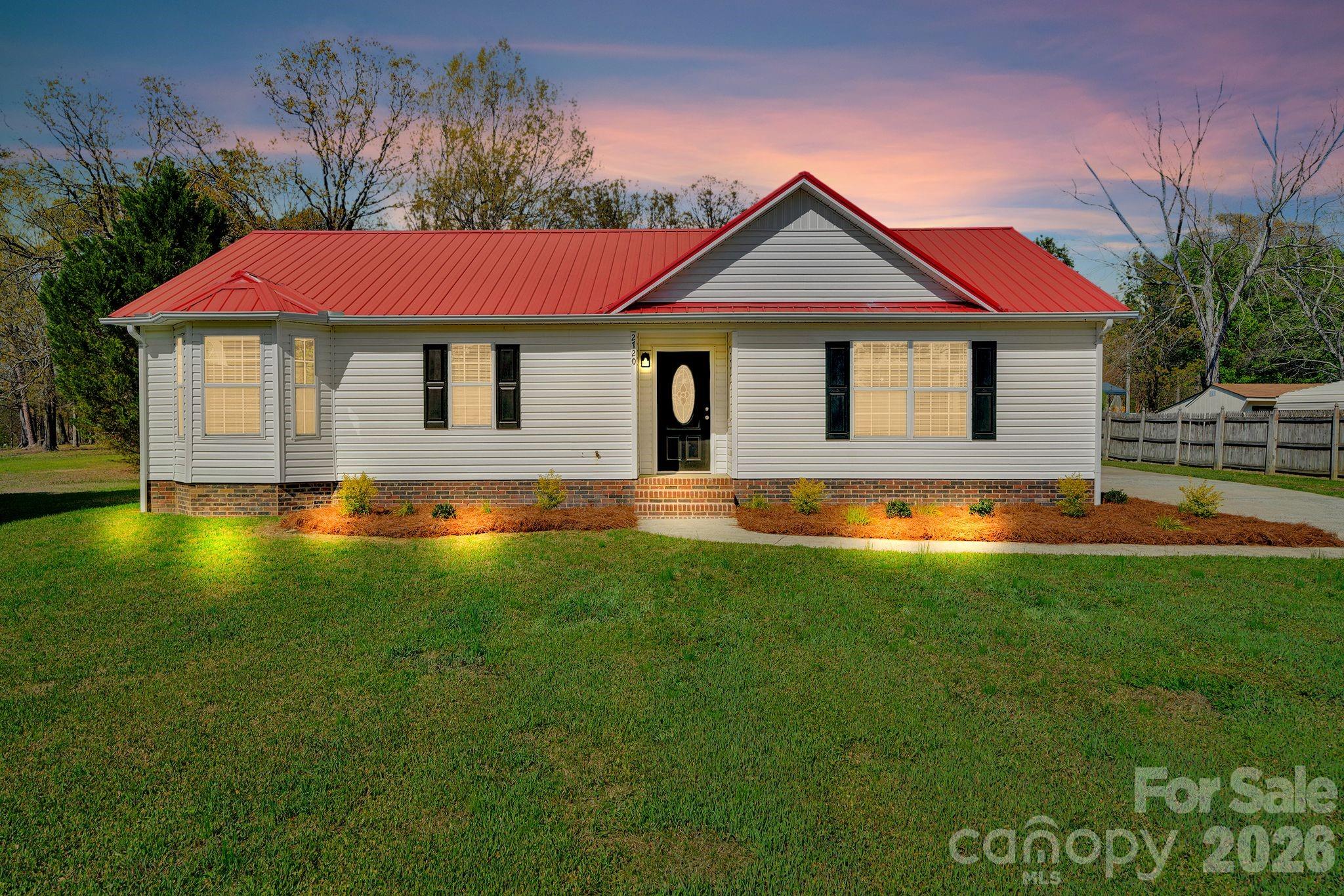 2720 Goldmine Road Monroe, NC 28110 - Photo 1 of 31 a front view of a house with yard
