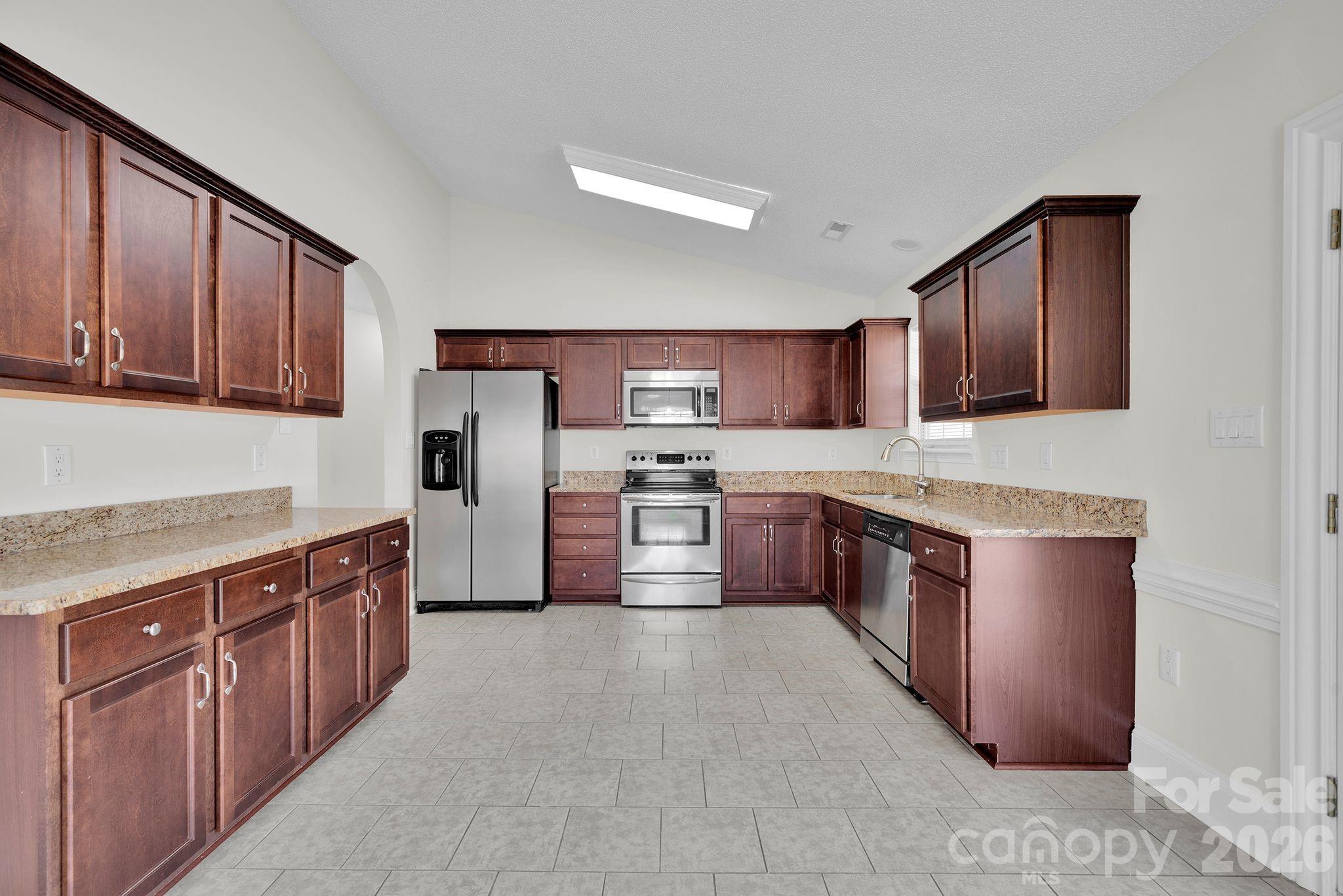 2720 Goldmine Road Monroe, NC 28110 - Photo 12 of 31 a large kitchen with stainless steel appliances lots of counter top space