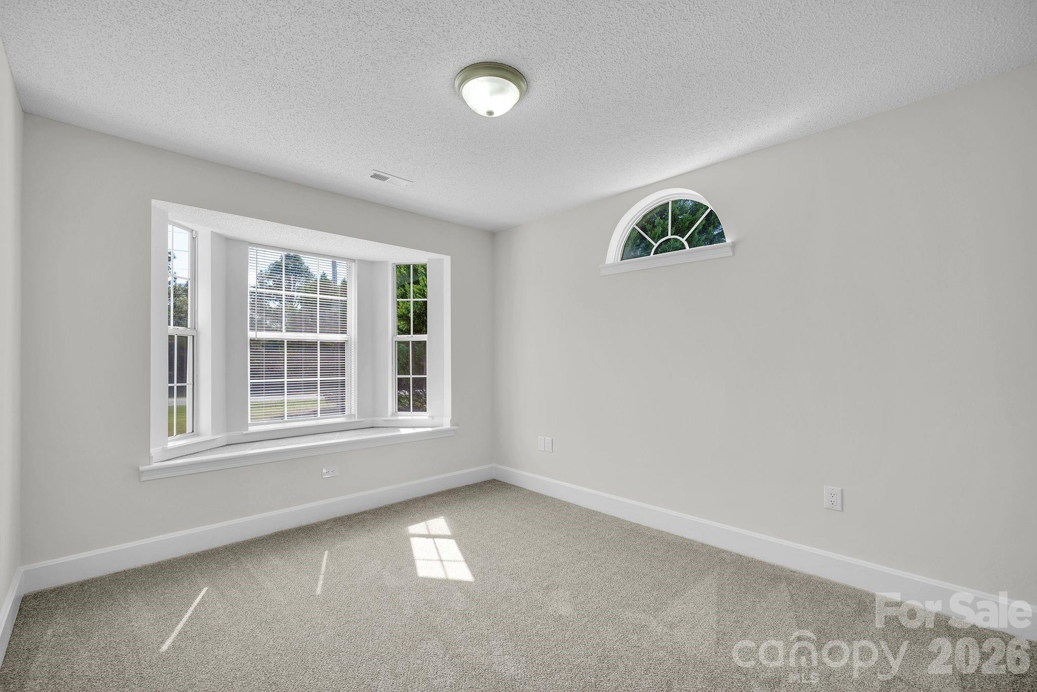 2720 Goldmine Road Monroe, NC 28110 - Photo 18 of 31 an empty room with a window