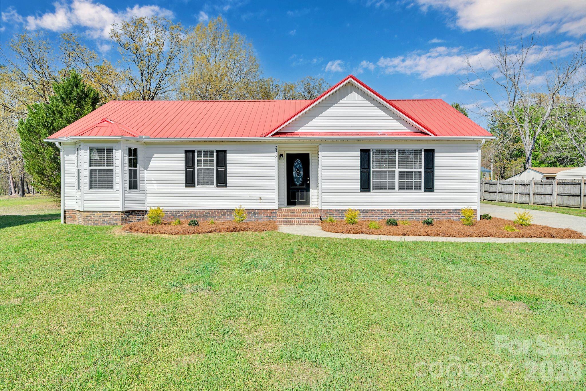 2720 Goldmine Road Monroe, NC 28110 - Photo 2 of 31 a front view of a house with yard and porch