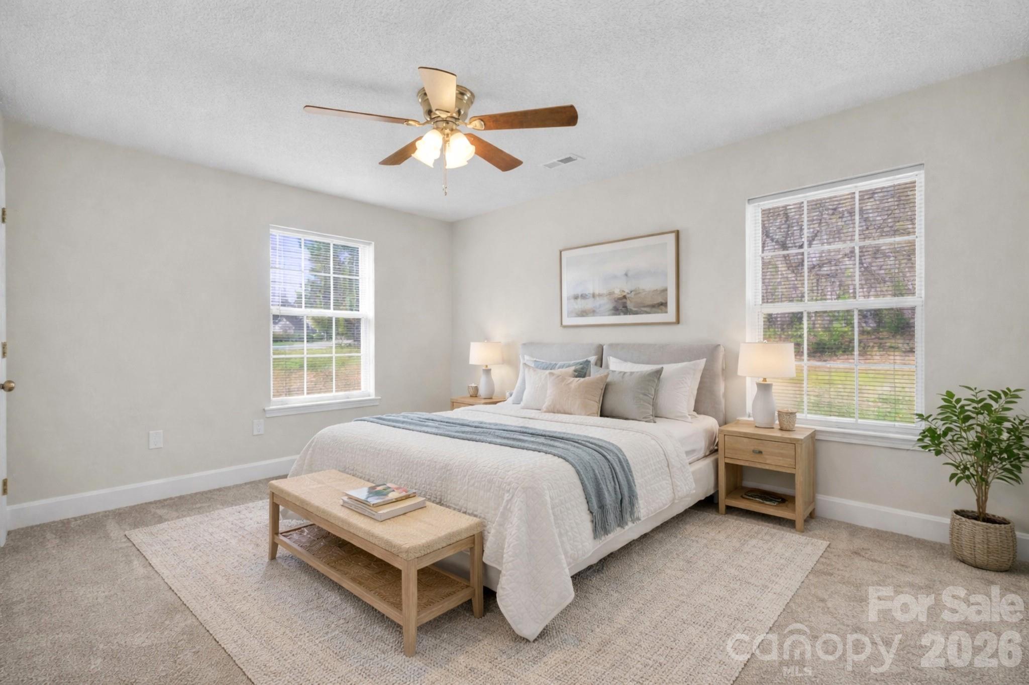 2720 Goldmine Road Monroe, NC 28110 - Photo 22 of 31 a bedroom with a bed and a potted plant