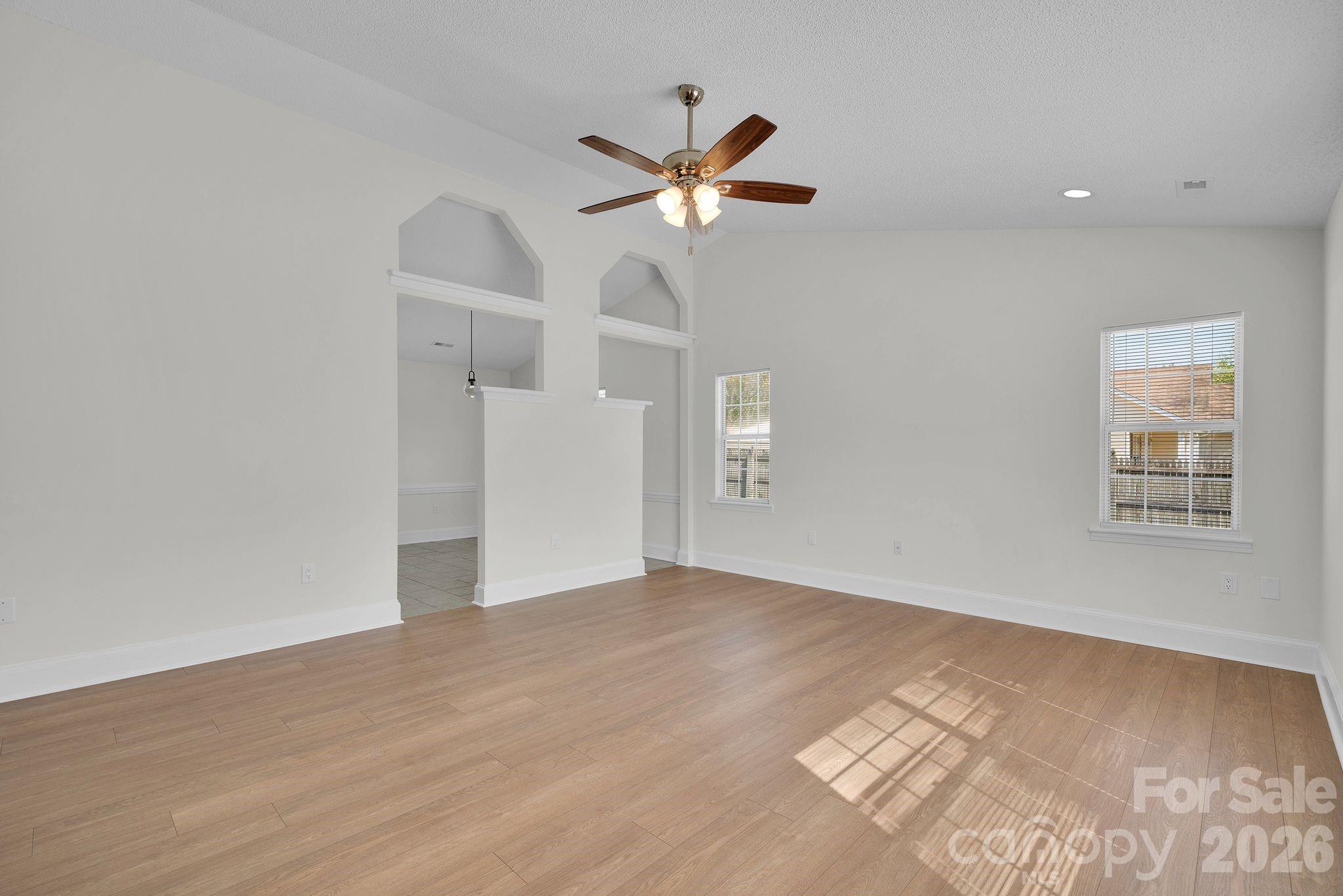 2720 Goldmine Road Monroe, NC 28110 - Photo 7 of 31 a view of empty room with wooden floor and fan