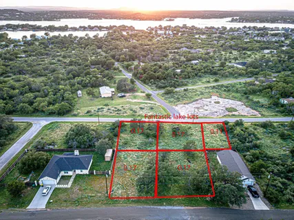 an aerial view of residential houses and outdoor space