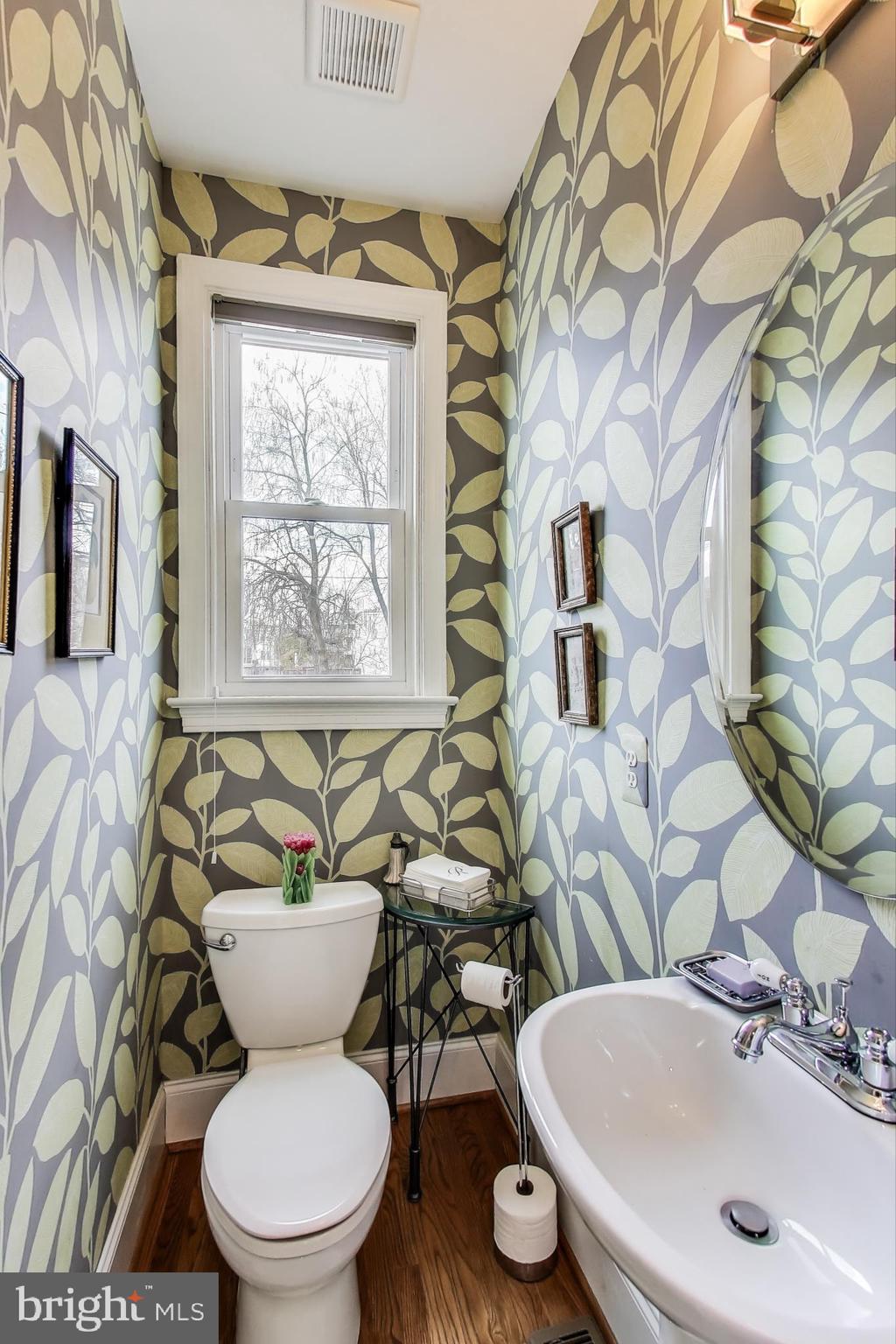 5708 4th Street Northwest Washington, DC 20011 - Photo 14 of 53 a bathroom with a toilet sink and mirror
