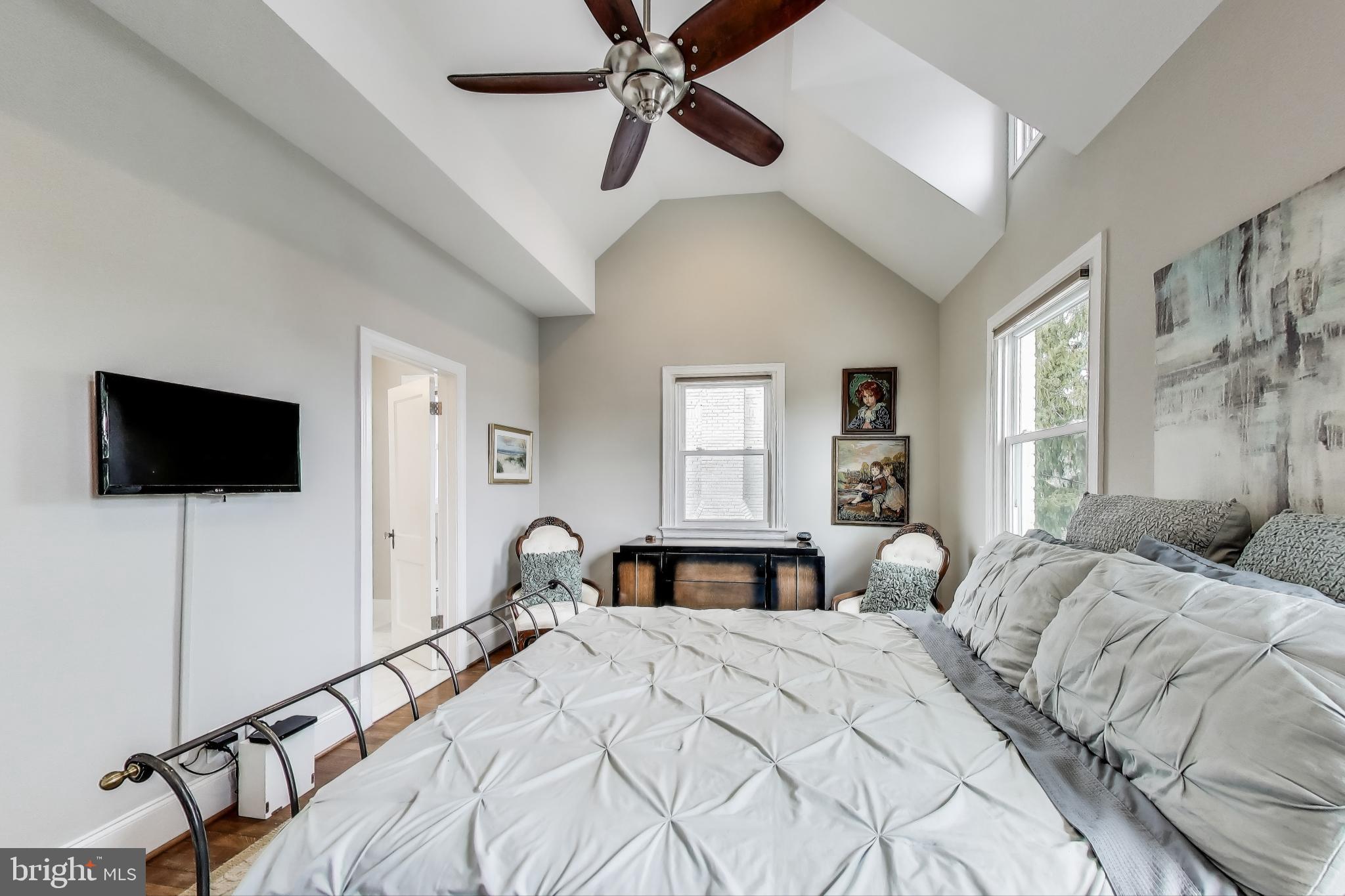 5708 4th Street Northwest Washington, DC 20011 - Photo 21 of 53 a bedroom with a bed and a flat screen tv