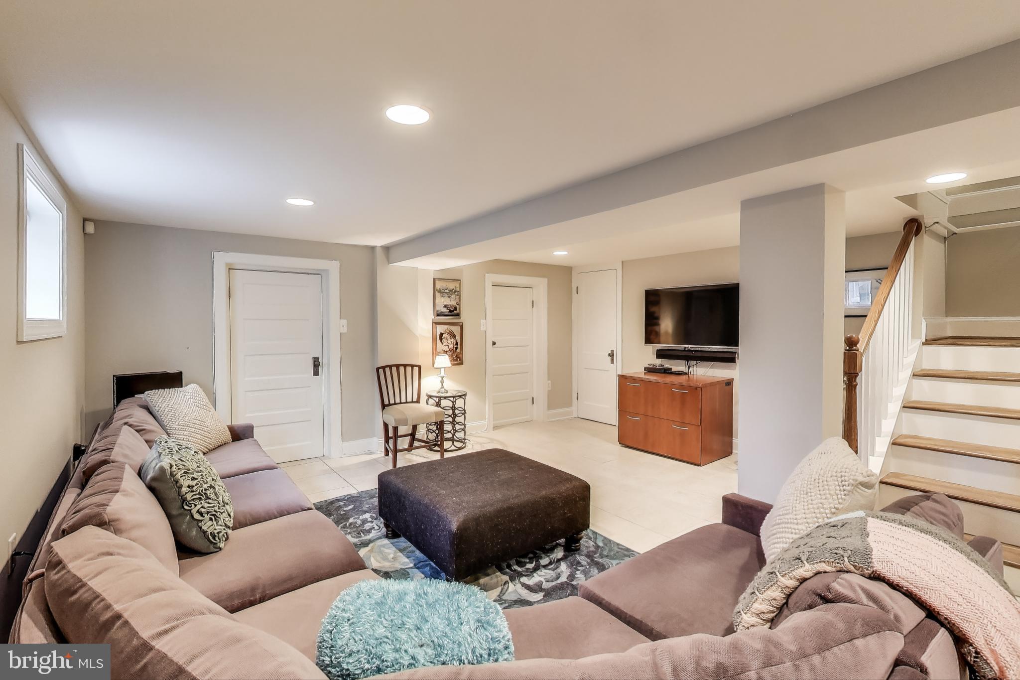5708 4th Street Northwest Washington, DC 20011 - Photo 36 of 53 a living room with furniture and a flat screen tv