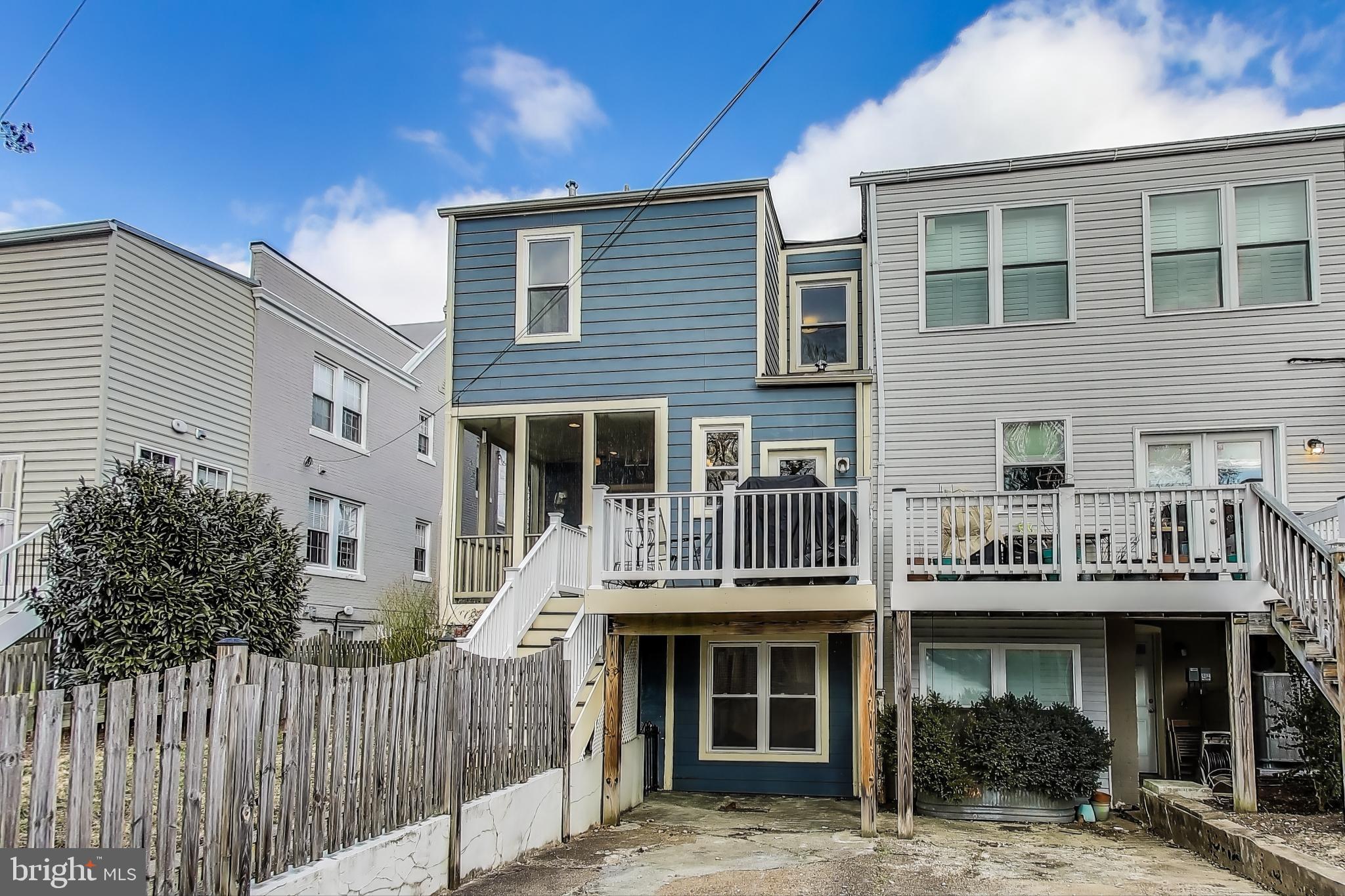 5708 4th Street Northwest Washington, DC 20011 - Photo 50 of 53 a front view of a residential apartment building with a yard