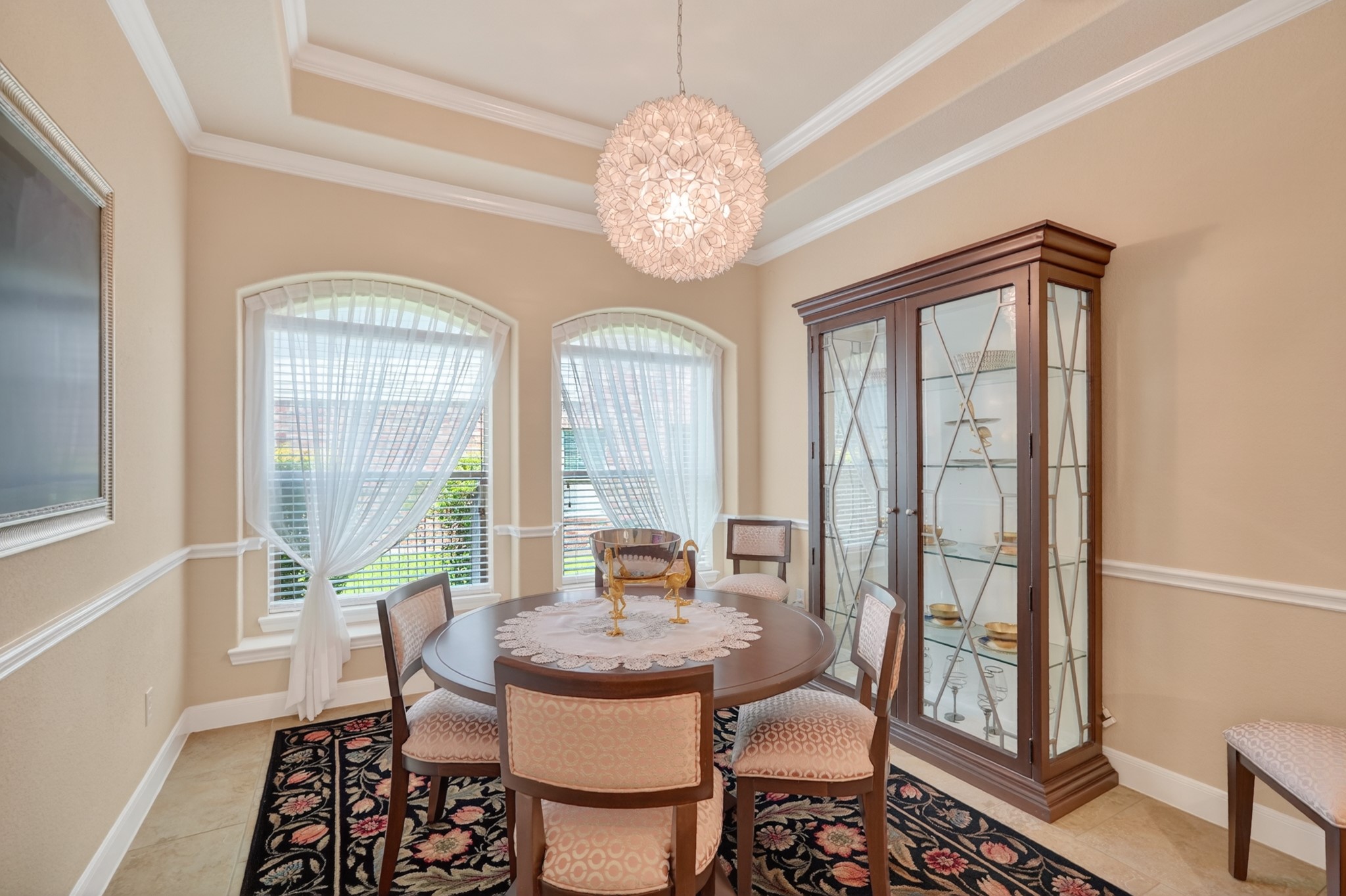 55 South Victoriana Circle Spring, TX 77389 - Photo 11 of 40 a dining room with furniture a chandelier and wooden floor