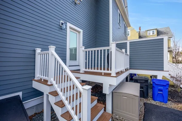a view of entryway with wooden stairs