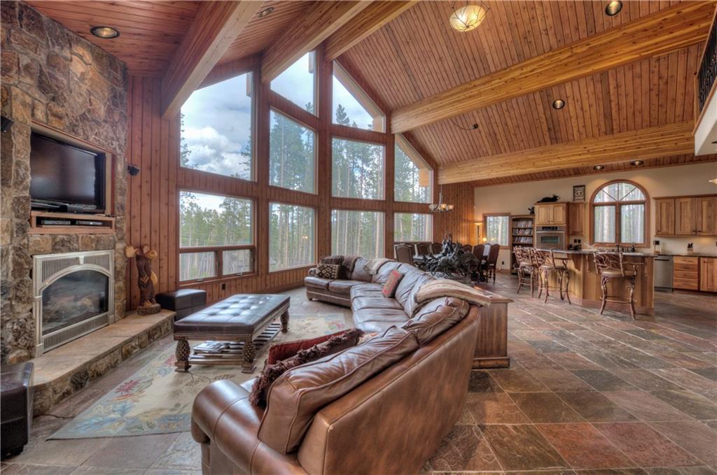 324 4 O'Clock Run Road Breckenridge, CO 80424 - Photo 1 of 25 a living room with furniture a fireplace and a flat screen tv
