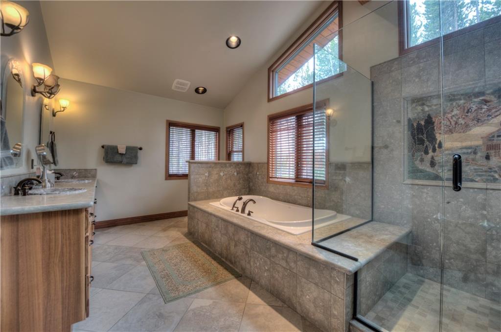 324 4 O'Clock Run Road Breckenridge, CO 80424 - Photo 11 of 25 a bathroom with a tub sink and mirror
