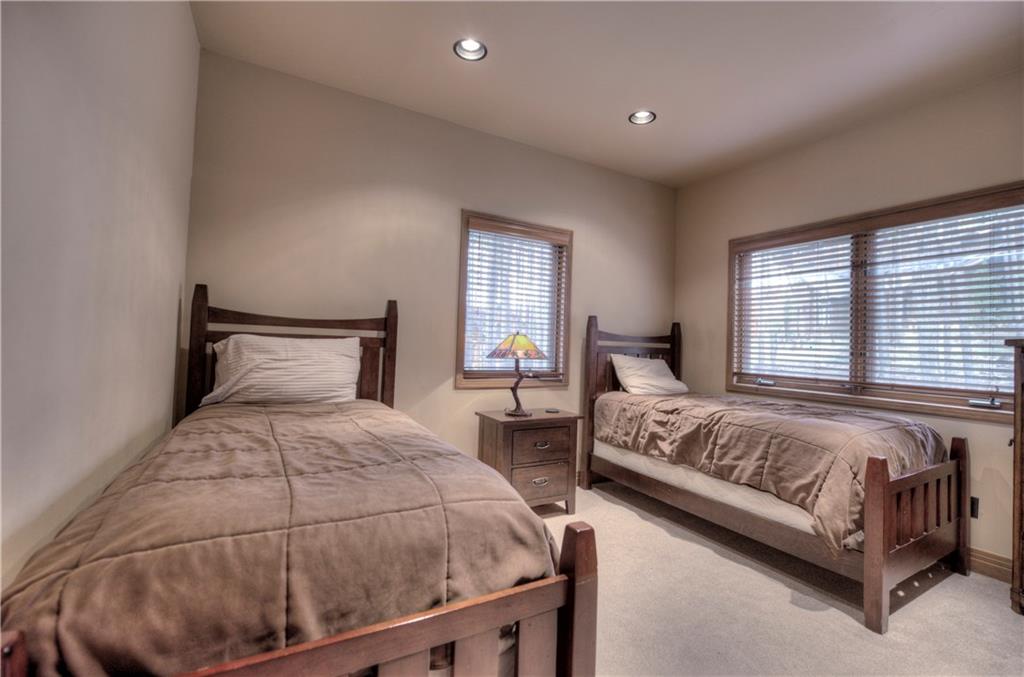 324 4 O'Clock Run Road Breckenridge, CO 80424 - Photo 13 of 25 a bedroom with two beds and a large window