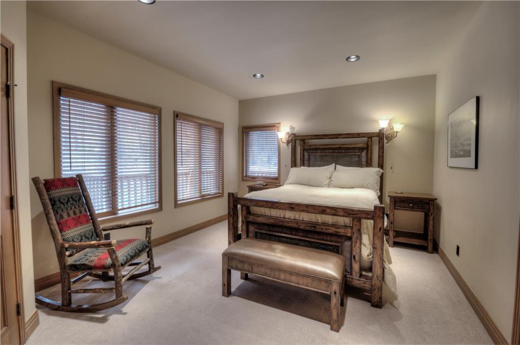 324 4 O'Clock Run Road Breckenridge, CO 80424 - Photo 14 of 25 a bedroom with a bed chair and glass door