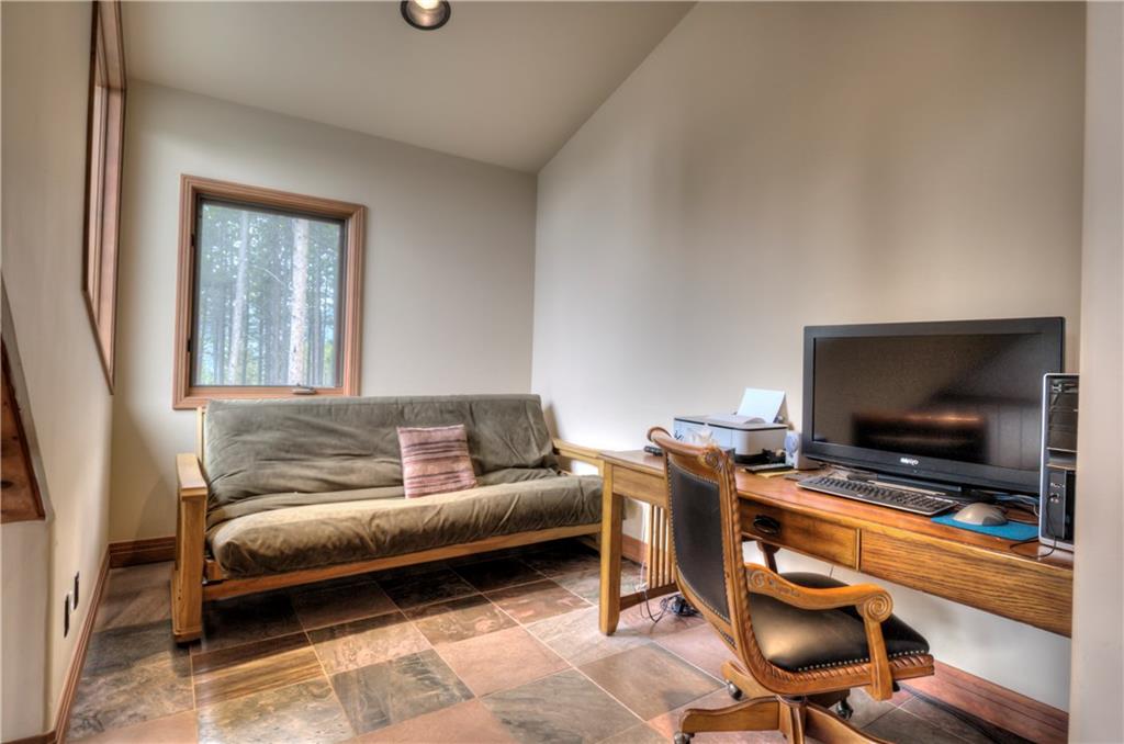 324 4 O'Clock Run Road Breckenridge, CO 80424 - Photo 18 of 25 a living room with furniture and a flat screen tv