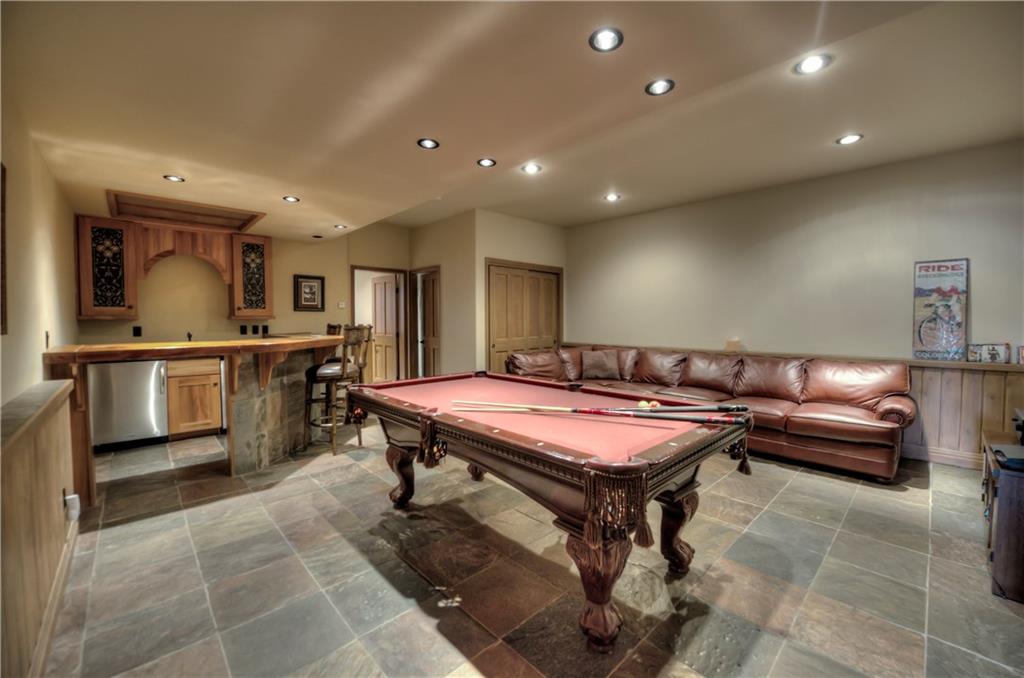 324 4 O'Clock Run Road Breckenridge, CO 80424 - Photo 20 of 25 a room with a table chairs and a kitchen