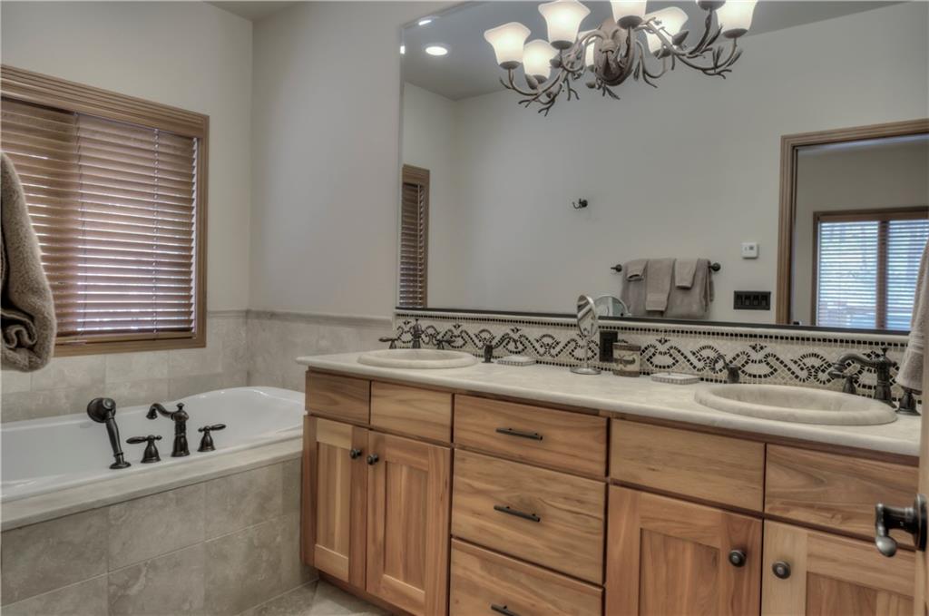 324 4 O'Clock Run Road Breckenridge, CO 80424 - Photo 23 of 25 a bathroom with a sink vanity and a mirror