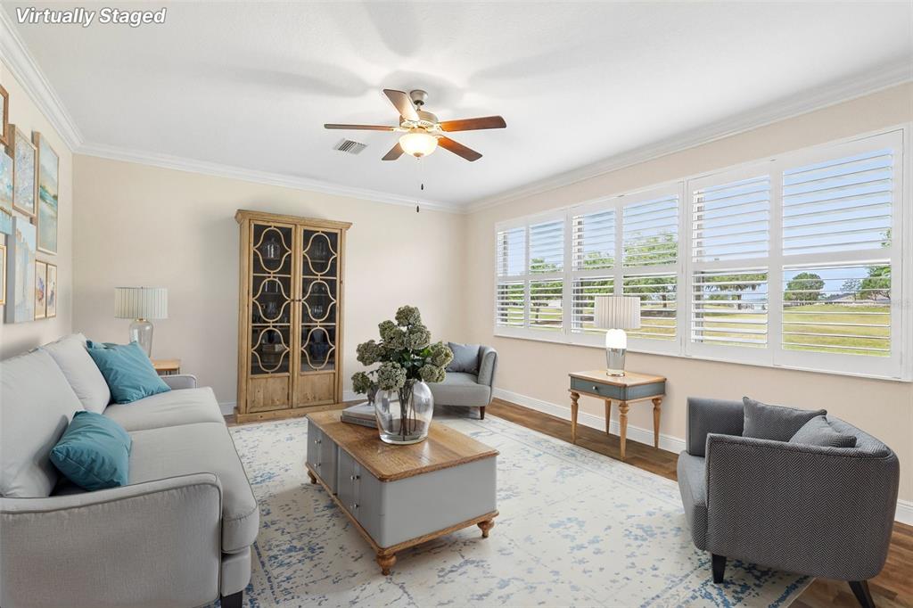 3522 Arlington Ridge Boulevard Leesburg, FL 34748 - Photo 12 of 43 a living room with furniture and a large window