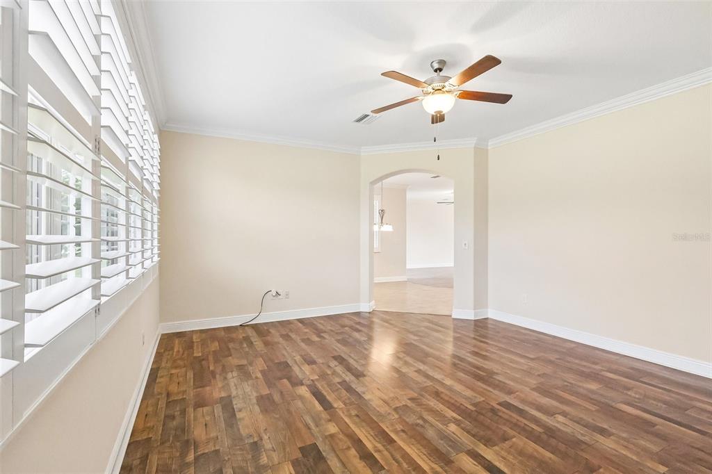 3522 Arlington Ridge Boulevard Leesburg, FL 34748 - Photo 14 of 43 a view of empty room with wooden floor and fan