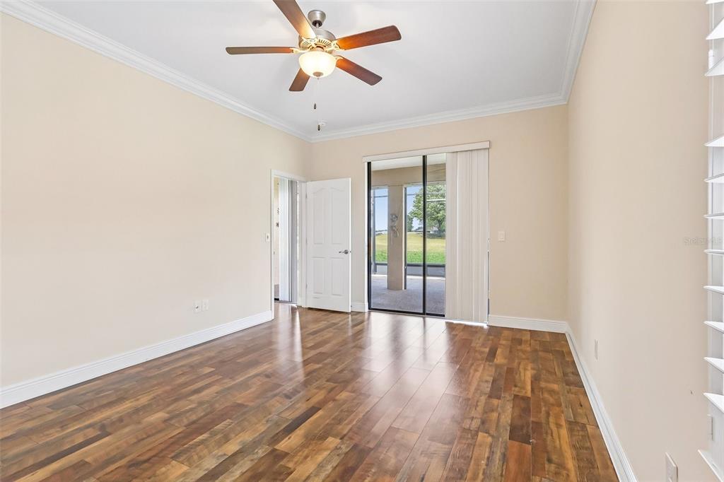 3522 Arlington Ridge Boulevard Leesburg, FL 34748 - Photo 20 of 43 an empty room with wooden floor and windows