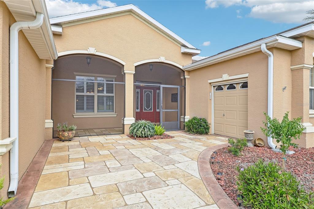 3522 Arlington Ridge Boulevard Leesburg, FL 34748 - Photo 2 of 43 a front view of a house with garden