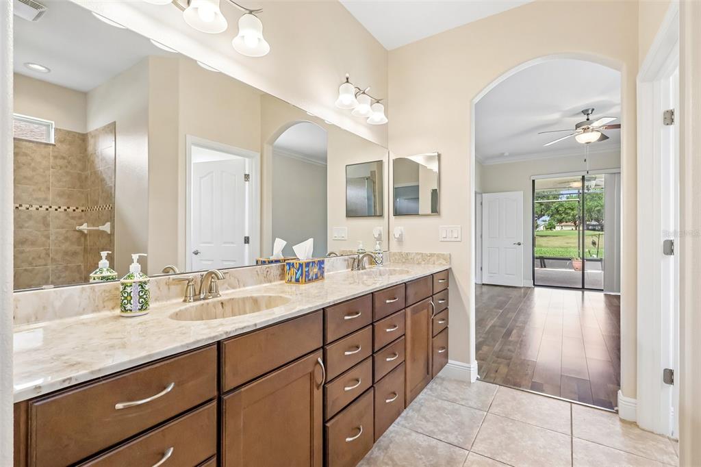 3522 Arlington Ridge Boulevard Leesburg, FL 34748 - Photo 22 of 43 a bathroom with a granite countertop sink mirror and double