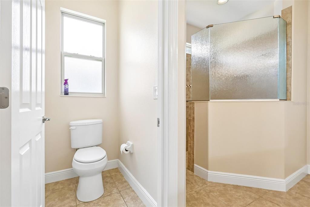 3522 Arlington Ridge Boulevard Leesburg, FL 34748 - Photo 23 of 43 a bathroom with a toilet and a shower