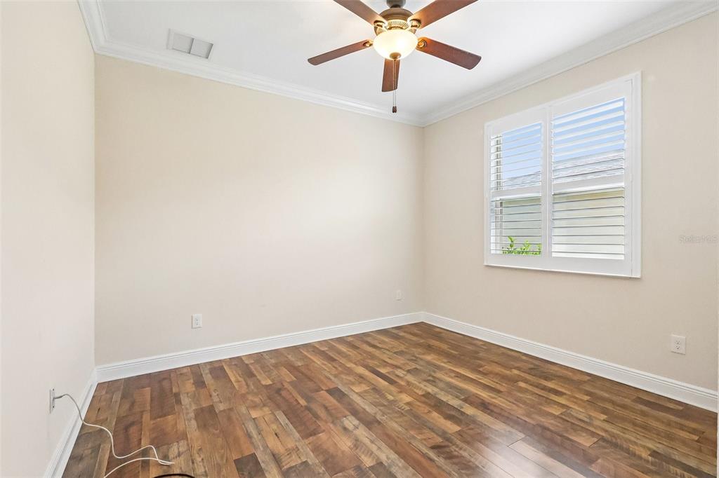 3522 Arlington Ridge Boulevard Leesburg, FL 34748 - Photo 24 of 43 an empty room with a window and a fan