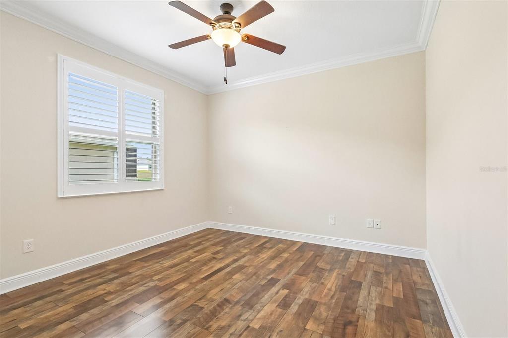 3522 Arlington Ridge Boulevard Leesburg, FL 34748 - Photo 26 of 43 an empty room with a window and a fan