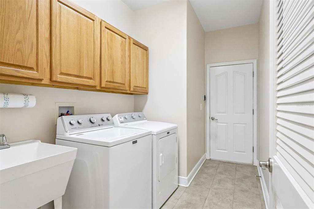 3522 Arlington Ridge Boulevard Leesburg, FL 34748 - Photo 27 of 43 a utility room with a sink washer and dryer