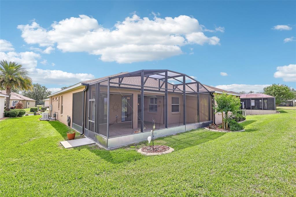 3522 Arlington Ridge Boulevard Leesburg, FL 34748 - Photo 31 of 43 a view of a house with a yard and a garden